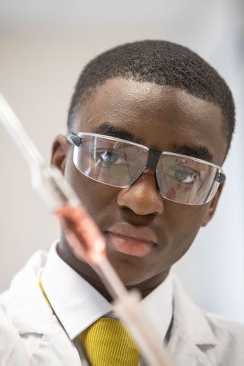 Sixth Form student performing a science experiment